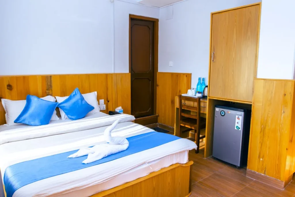Private Room with mini fridge and working desk at Roamers inn